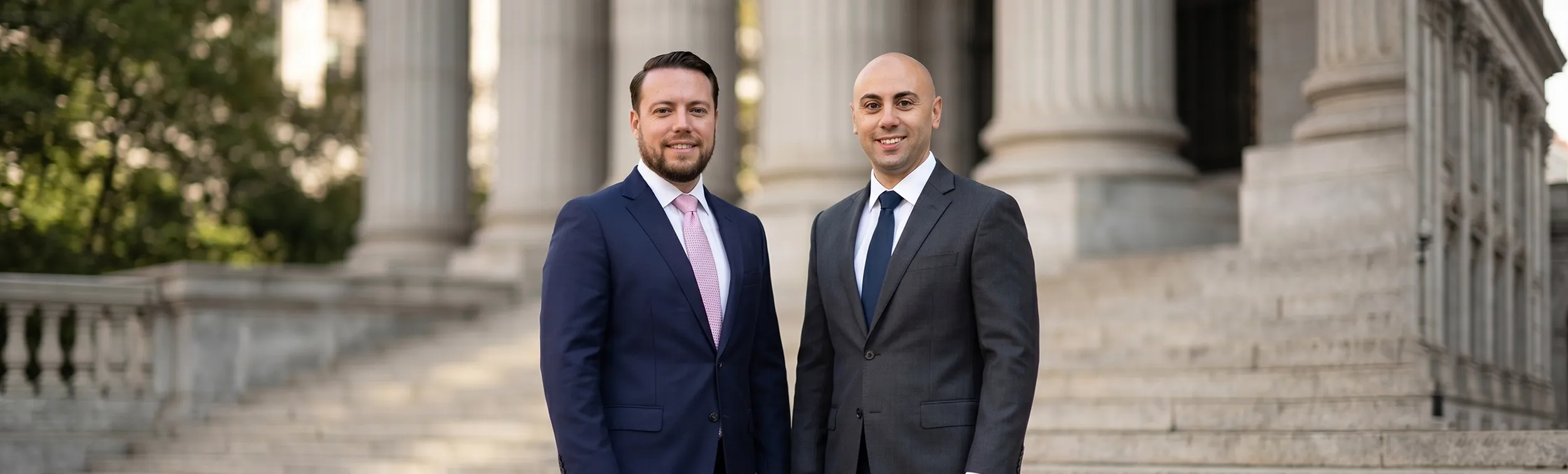GB Law Firm partners Philip Gurevich and Albert Buznik outside a courthouse